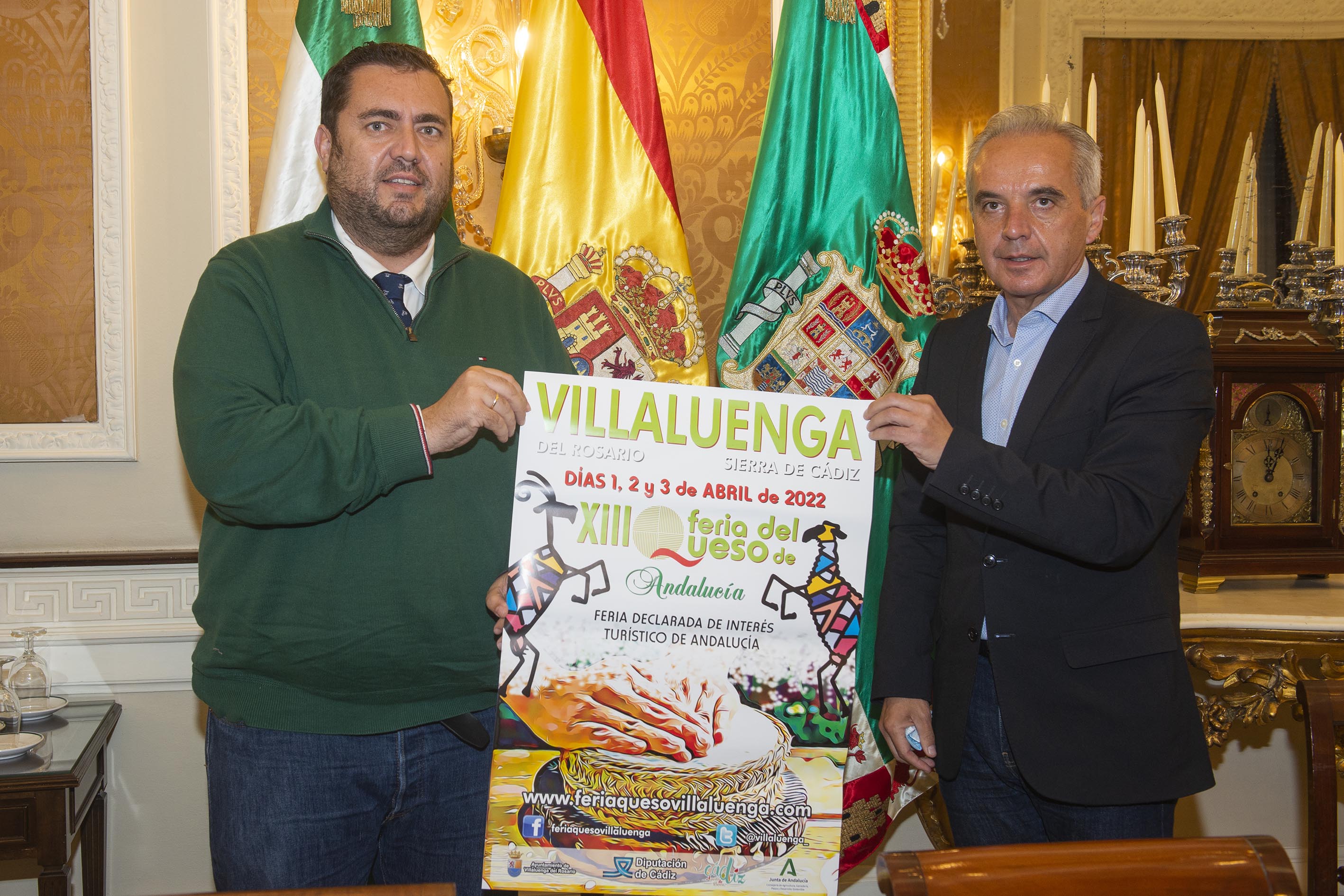 Jaime Armario y Alfonso Moscoso, con el cartel de la Feria del Queso de Villaluenga